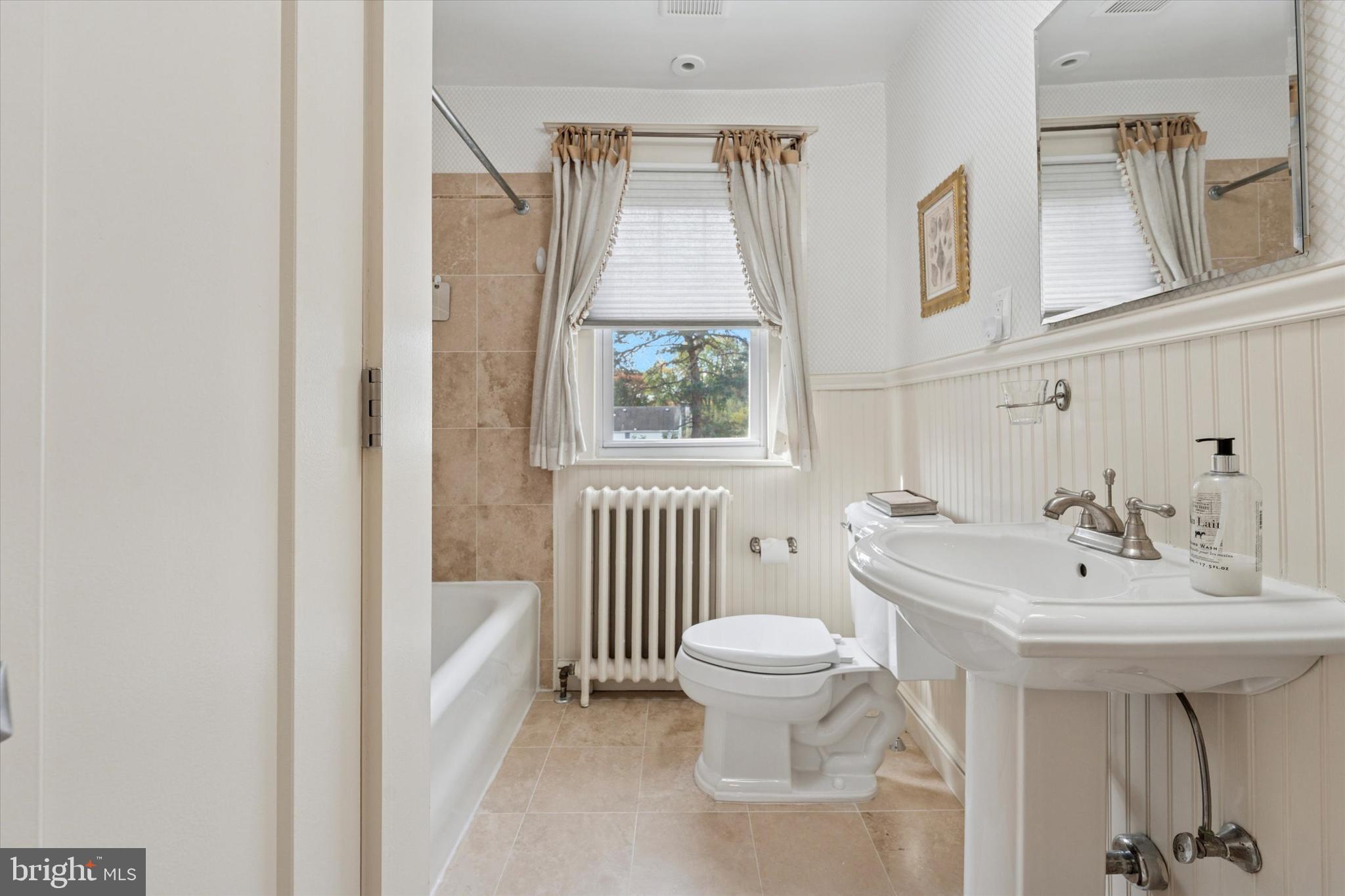 2918 Rising Sun Road Ardmore, PA 19003 - Photo 26 of 33 a bathroom with a sink toilet and a bathtub