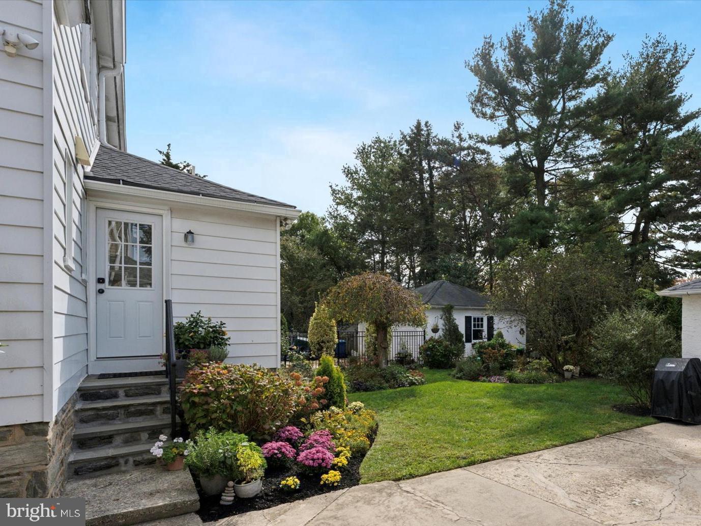 2918 Rising Sun Road Ardmore, PA 19003 - Photo 31 of 33 a front view of a house with a garden