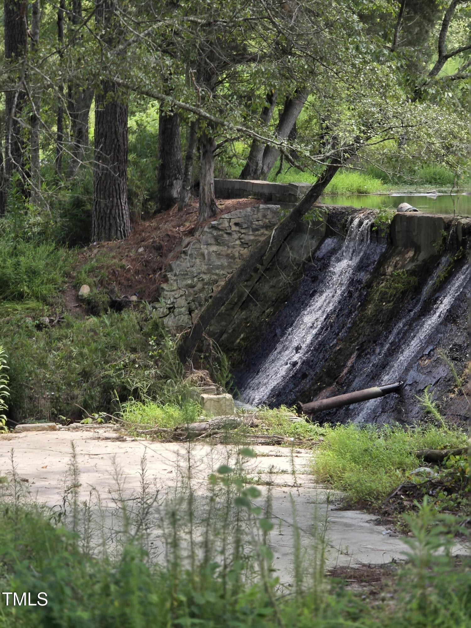 0 Dukes Lake Road Zebulon, NC 27597 - Photo 3 of 11 a view of a backyard of the house