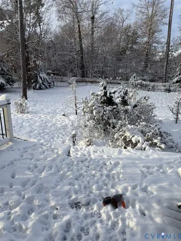 a view of a yard covered with snow