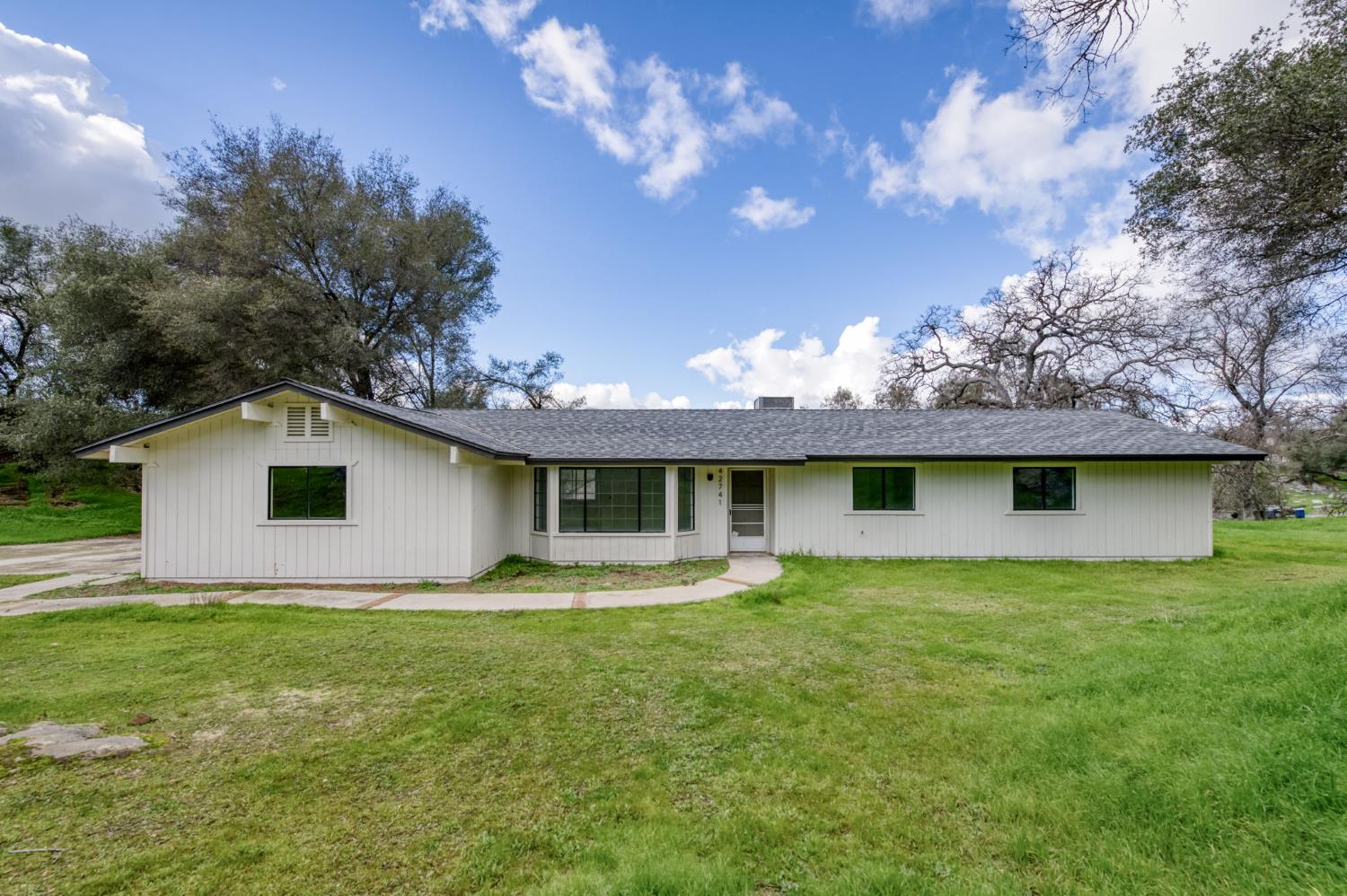 a view of a house with a garden