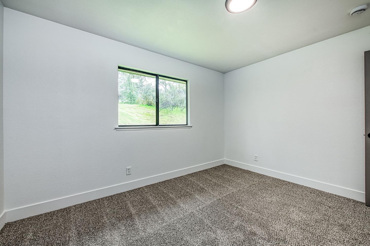 42741 Revis Way Coarsegold, CA 93614 - Photo 14 of 17 an empty room with a window