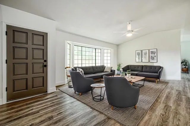 a living room with furniture and a window