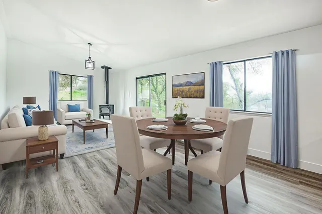 a view of a dining room with furniture window and wooden floor