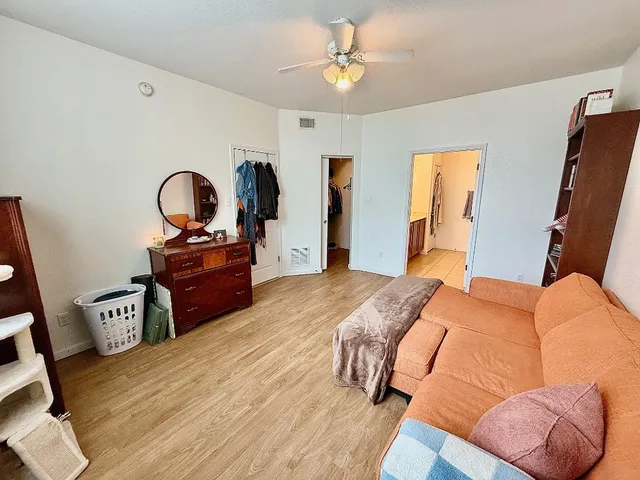 a bed room with a bed and a television