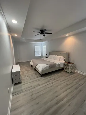 a bedroom with bed and a couch