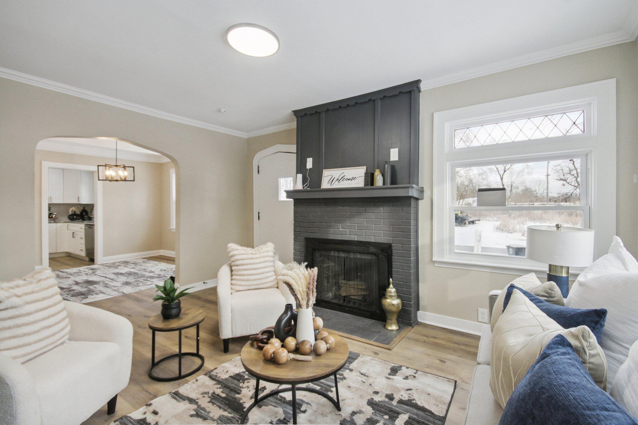 1012 Oklahoma Street Gary, IN 46403 - Photo 4 of 18 a living room with furniture and a fireplace