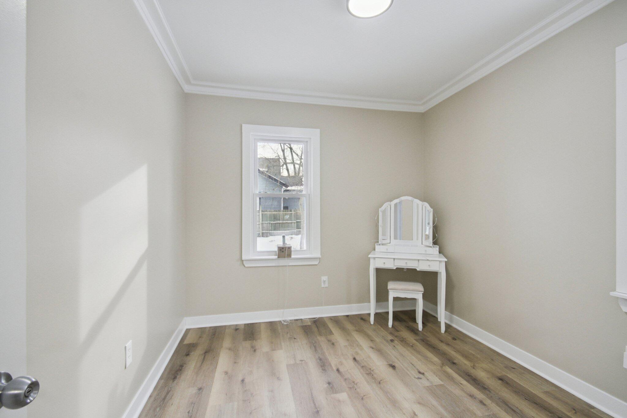 1012 Oklahoma Street Gary, IN 46403 - Photo 6 of 18 an empty room with windows