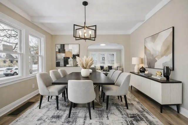 a view of a dining room with furniture window and wooden floor