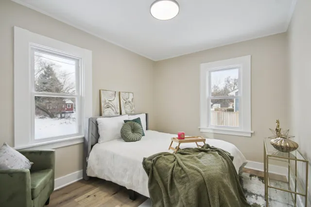 a bedroom with a bed and window