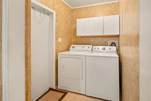 a view of a livingroom with a window and a flat screen tv