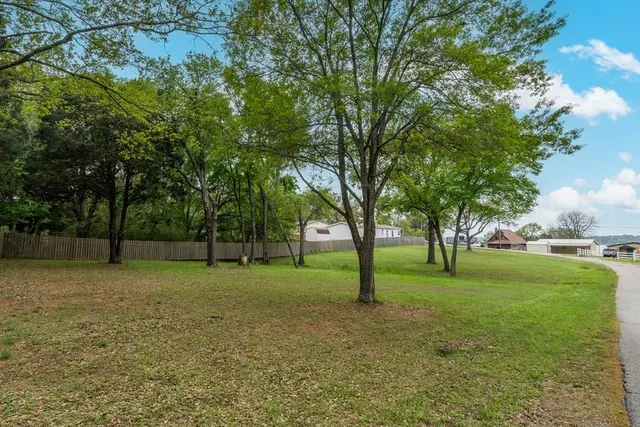 an aerial view of residential house with outdoor space
