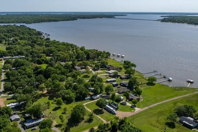 an aerial view of residential house with outdoor space and river