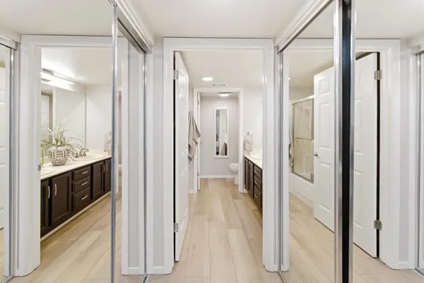 a view of a bathroom from a hallway