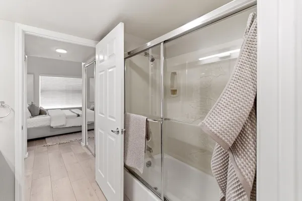 a bathroom with a bathtub and a shower