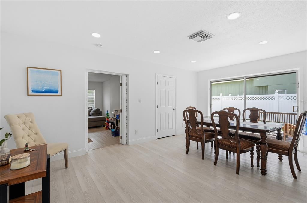 1946 Strathaven Road Winter Park, FL 32792 - Photo 20 of 37 a view of a dining room with furniture and wooden floor