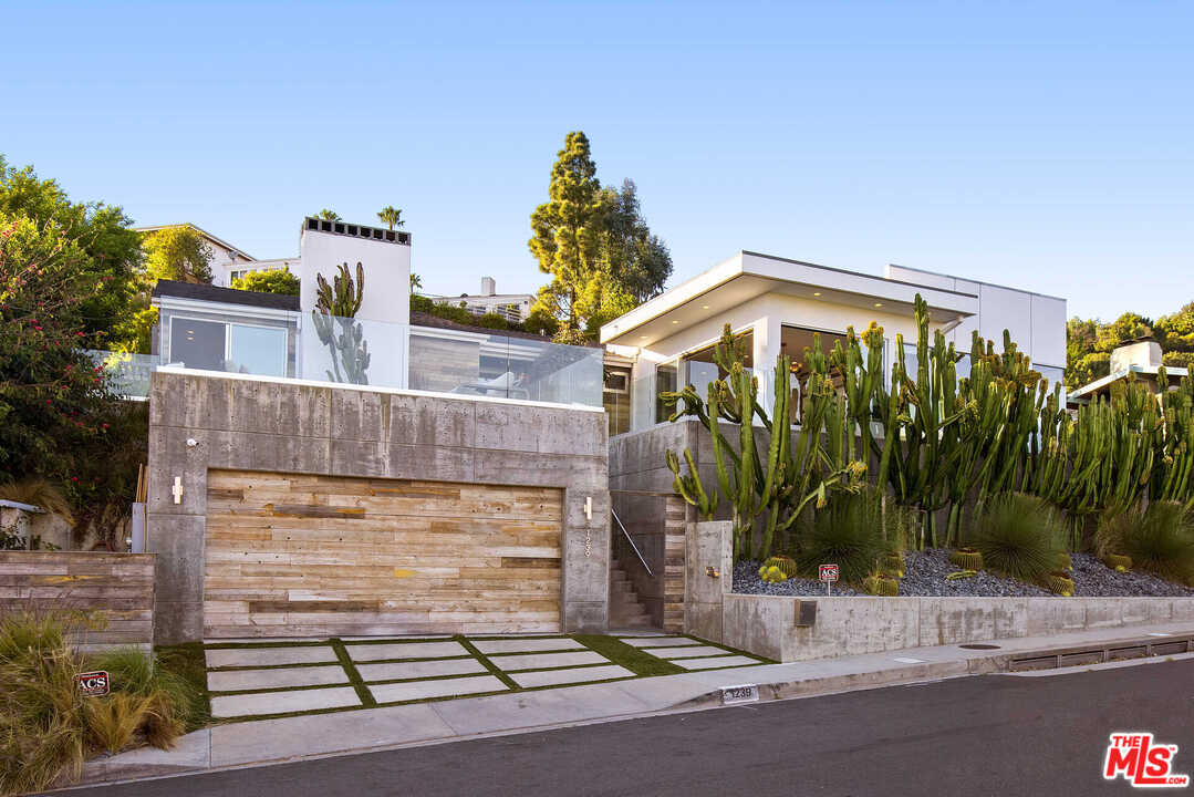 1239 Las Pulgas Road Pacific Palisades, CA 90272 - Photo 2 of 54 a view of a house with a street