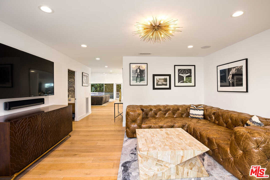 1239 Las Pulgas Road Pacific Palisades, CA 90272 - Photo 20 of 54 a living room with furniture and a flat screen tv