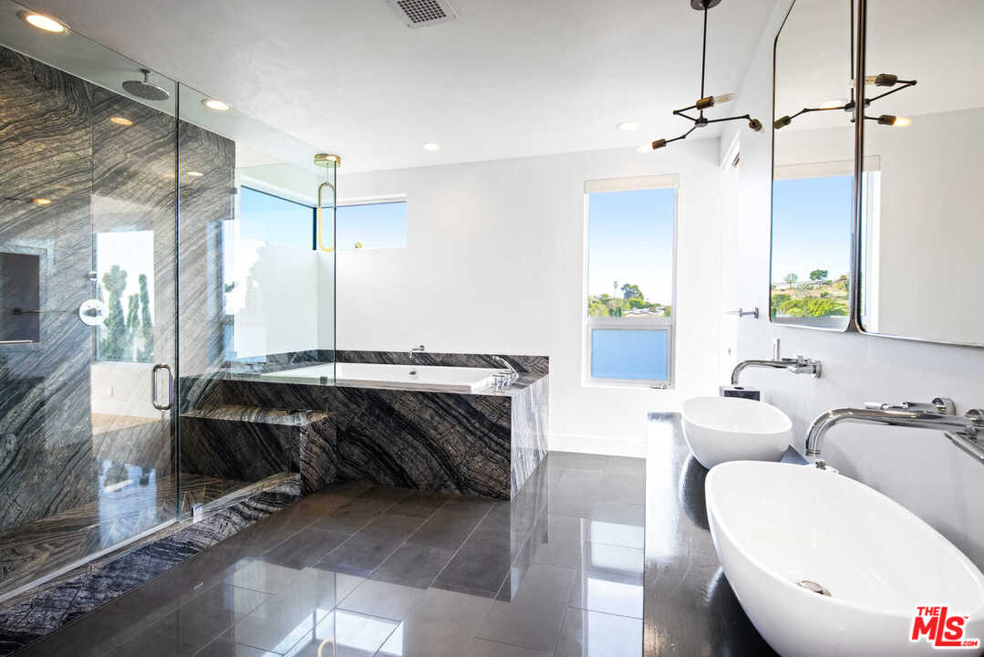 1239 Las Pulgas Road Pacific Palisades, CA 90272 - Photo 25 of 54 a bathroom with a double vanity sink and a mirror
