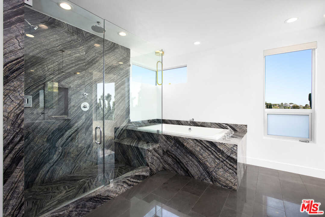 1239 Las Pulgas Road Pacific Palisades, CA 90272 - Photo 26 of 54 a bathroom with a sink and a mirror