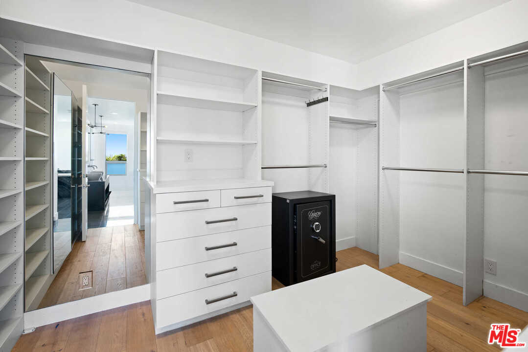 1239 Las Pulgas Road Pacific Palisades, CA 90272 - Photo 27 of 54 a kitchen with a refrigerator and a stove