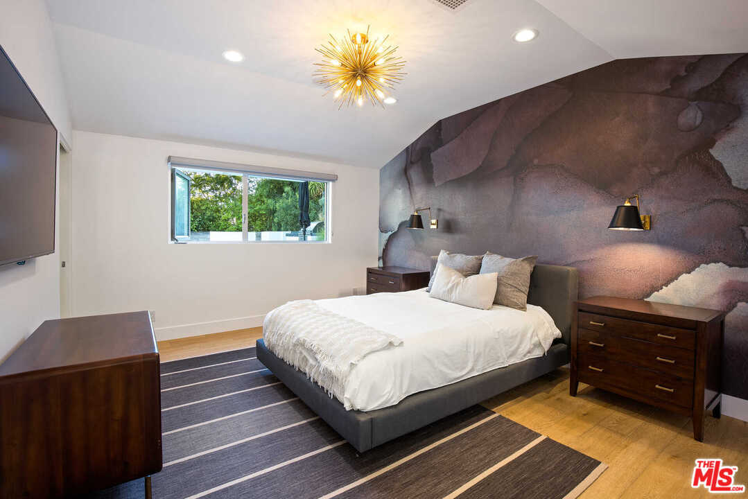 1239 Las Pulgas Road Pacific Palisades, CA 90272 - Photo 34 of 54 a bedroom with bed and window