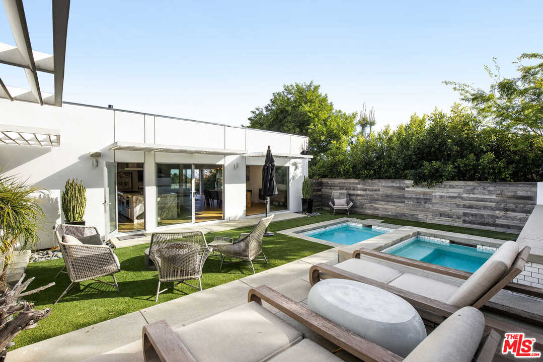 1239 Las Pulgas Road Pacific Palisades, CA 90272 - Photo 38 of 54 a view of a house with backyard