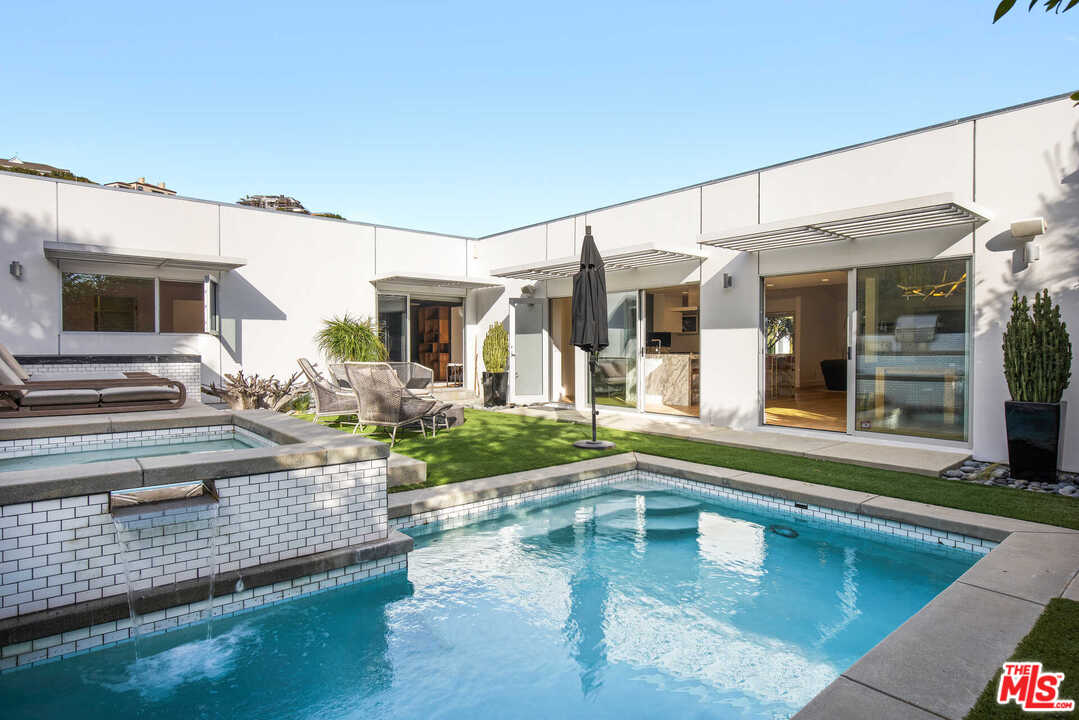 1239 Las Pulgas Road Pacific Palisades, CA 90272 - Photo 40 of 54 a view of a house with patio