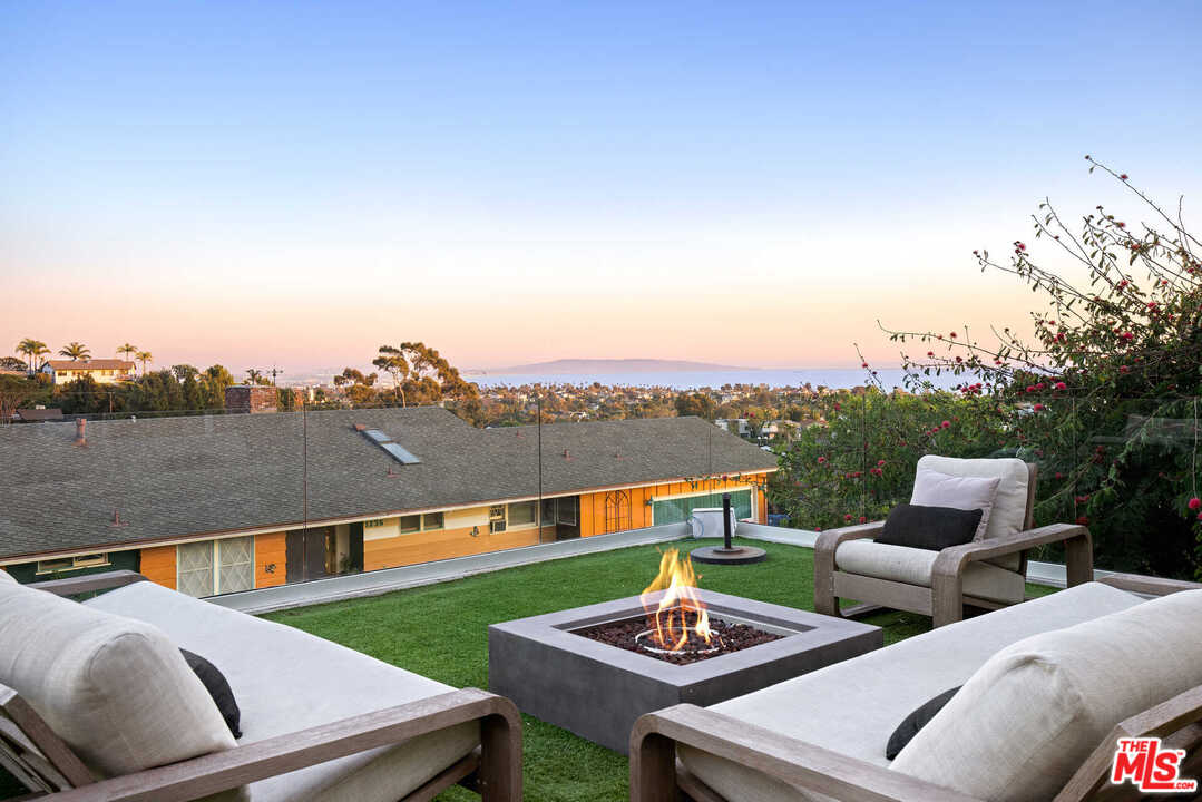 1239 Las Pulgas Road Pacific Palisades, CA 90272 - Photo 42 of 54 a view of a terrace with couches and a table