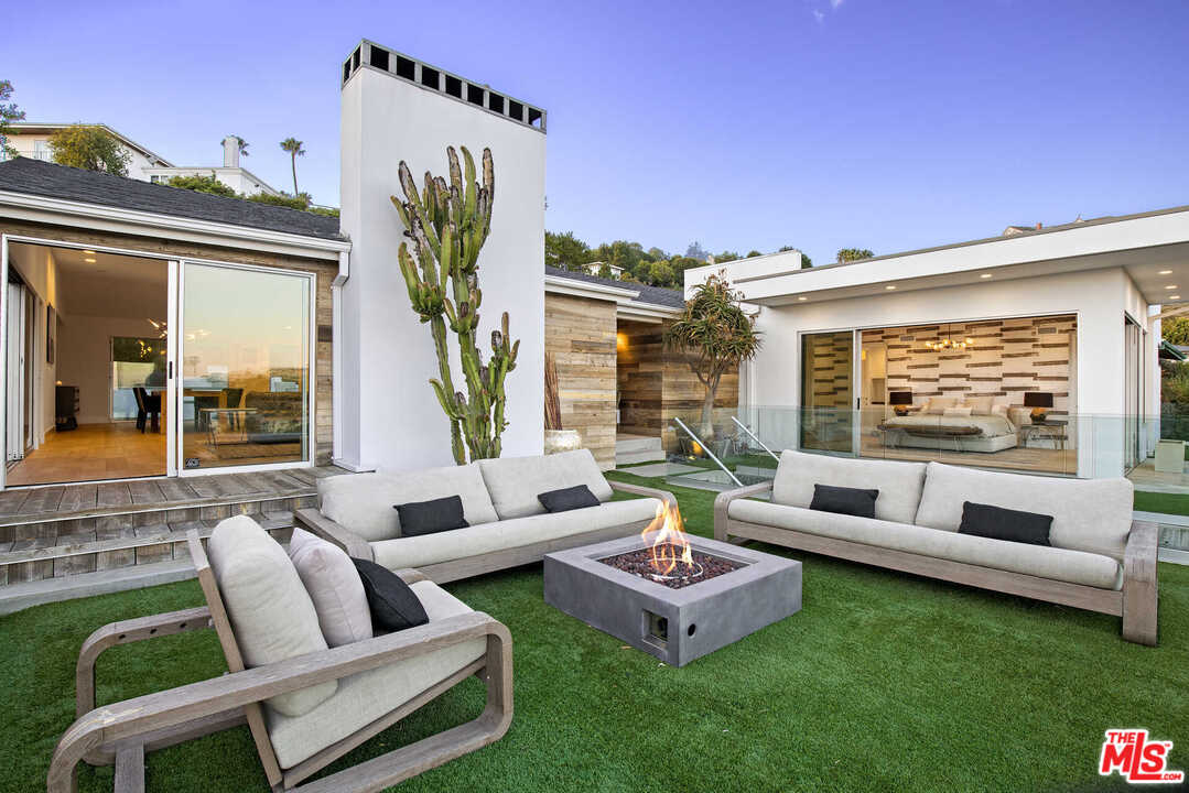 1239 Las Pulgas Road Pacific Palisades, CA 90272 - Photo 43 of 54 a outdoor living space with furniture and a potted plant