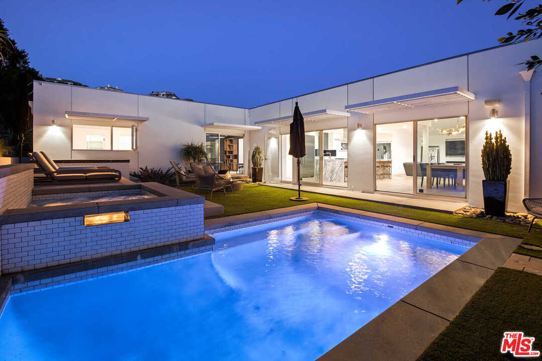 1239 Las Pulgas Road Pacific Palisades, CA 90272 - Photo 50 of 54 a swimming pool with outdoor seating