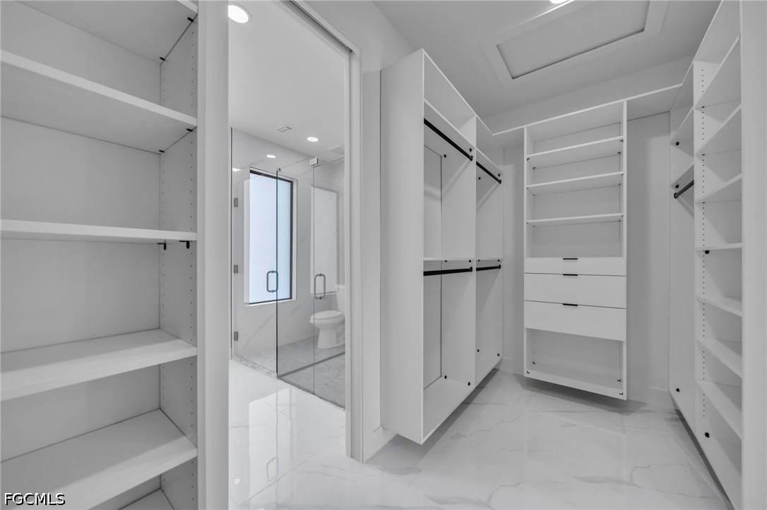 1618 Moore Avenue Lehigh Acres, FL 33972 - Photo 16 of 41 a bathroom with a shower and a glass door