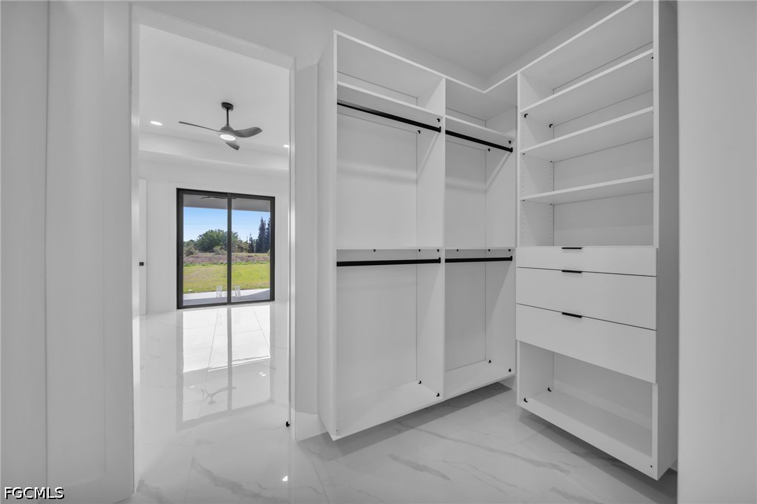 1618 Moore Avenue Lehigh Acres, FL 33972 - Photo 17 of 41 a view of an empty walk in closet