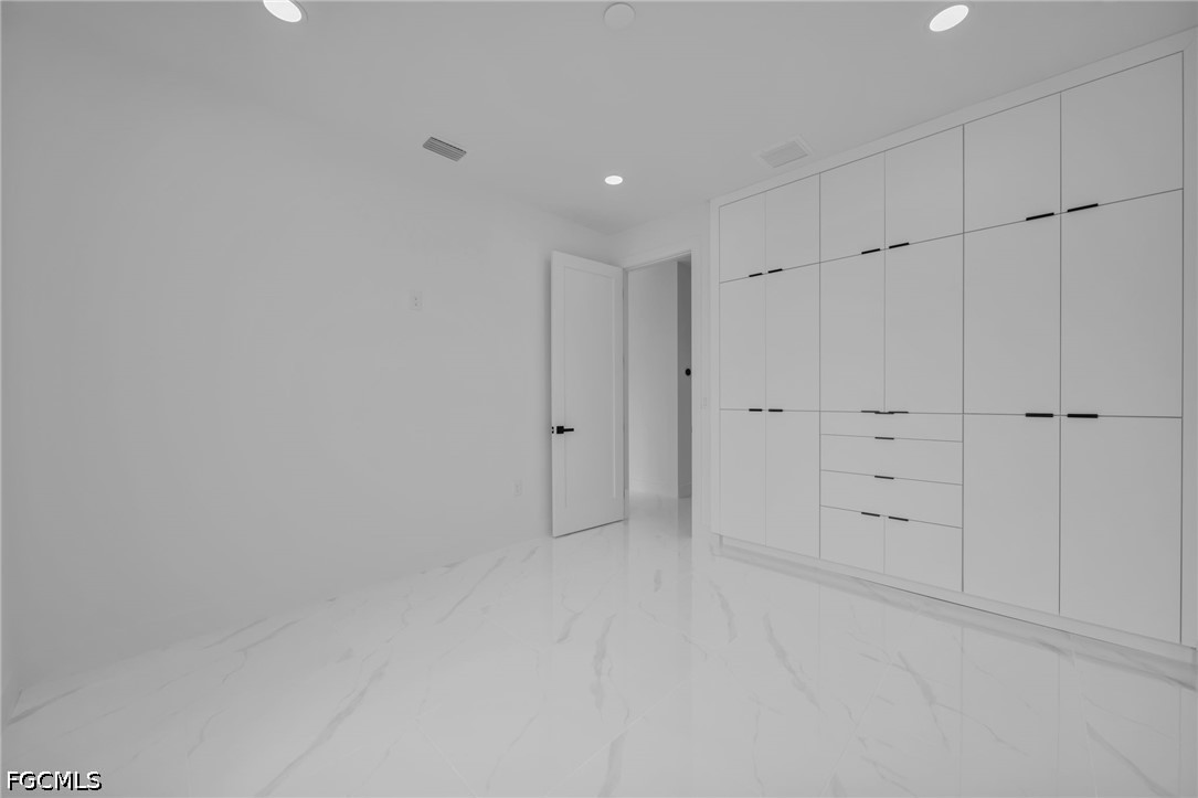 1618 Moore Avenue Lehigh Acres, FL 33972 - Photo 22 of 41 a view of an empty room