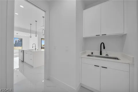 a view of a sink and cabinets