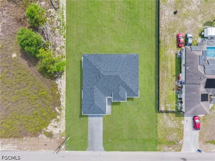 a bird view of house with yard