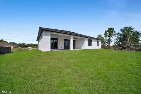 a view of house with backyard