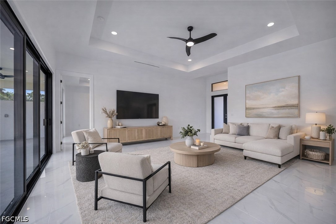 1618 Moore Avenue Lehigh Acres, FL 33972 - Photo 4 of 41 a living room with furniture and a flat screen tv