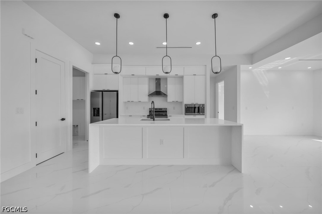 1618 Moore Avenue Lehigh Acres, FL 33972 - Photo 6 of 41 a view of kitchen with white cabinets