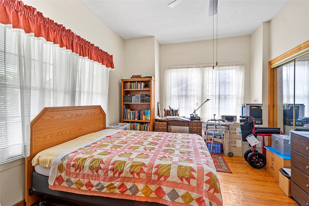 200 Louisiana Street Honea Path, SC 29654 - Photo 6 of 13 Hardwood floors and ample natural light define this cozy and functional living space.