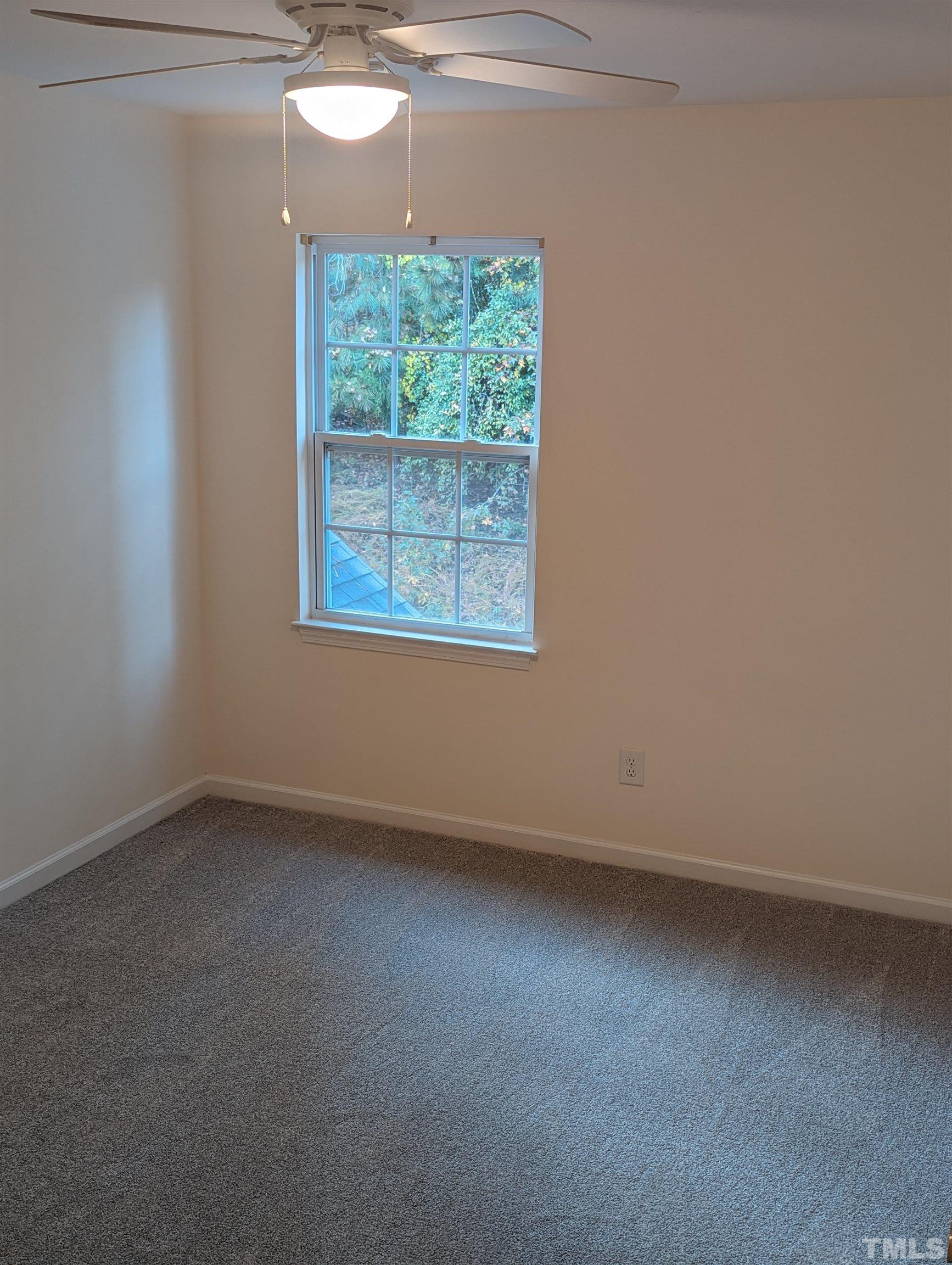 350 Plaza Drive, Unit D Chapel Hill, NC 27517 - Photo 3 of 13 an empty room with a window