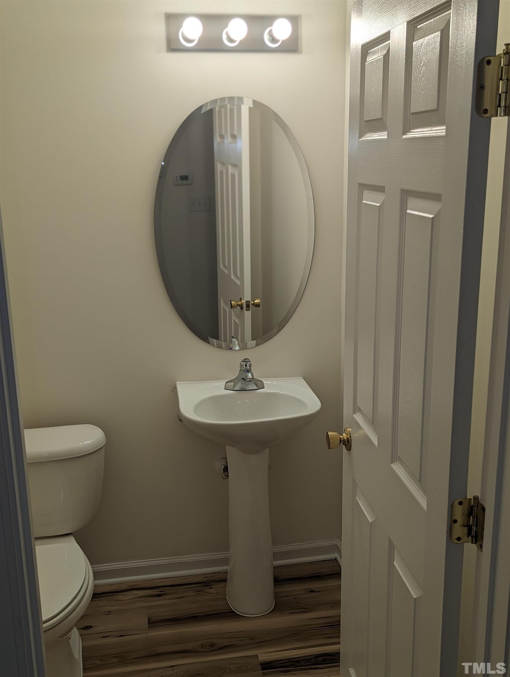 350 Plaza Drive, Unit D Chapel Hill, NC 27517 - Photo 8 of 13 a bathroom with a toilet a sink and mirror