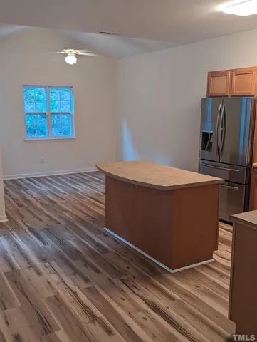 a kitchen with stainless steel appliances a sink stove and refrigerator