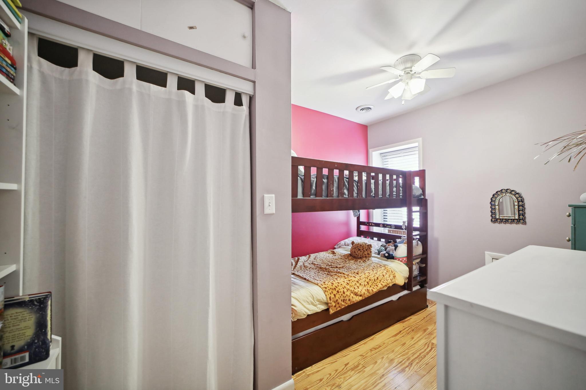 432 15th Street Southeast Washington, DC 20003 - Photo 17 of 26 a bedroom with a bed and a chandelier