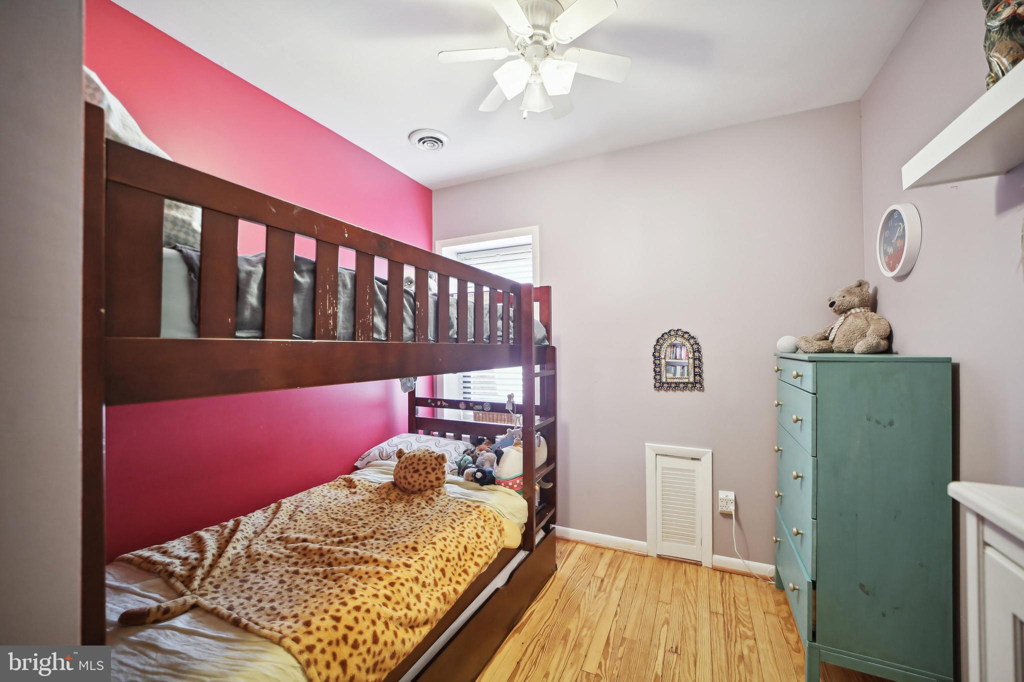 432 15th Street Southeast Washington, DC 20003 - Photo 18 of 26 a bed room with a bed and a window