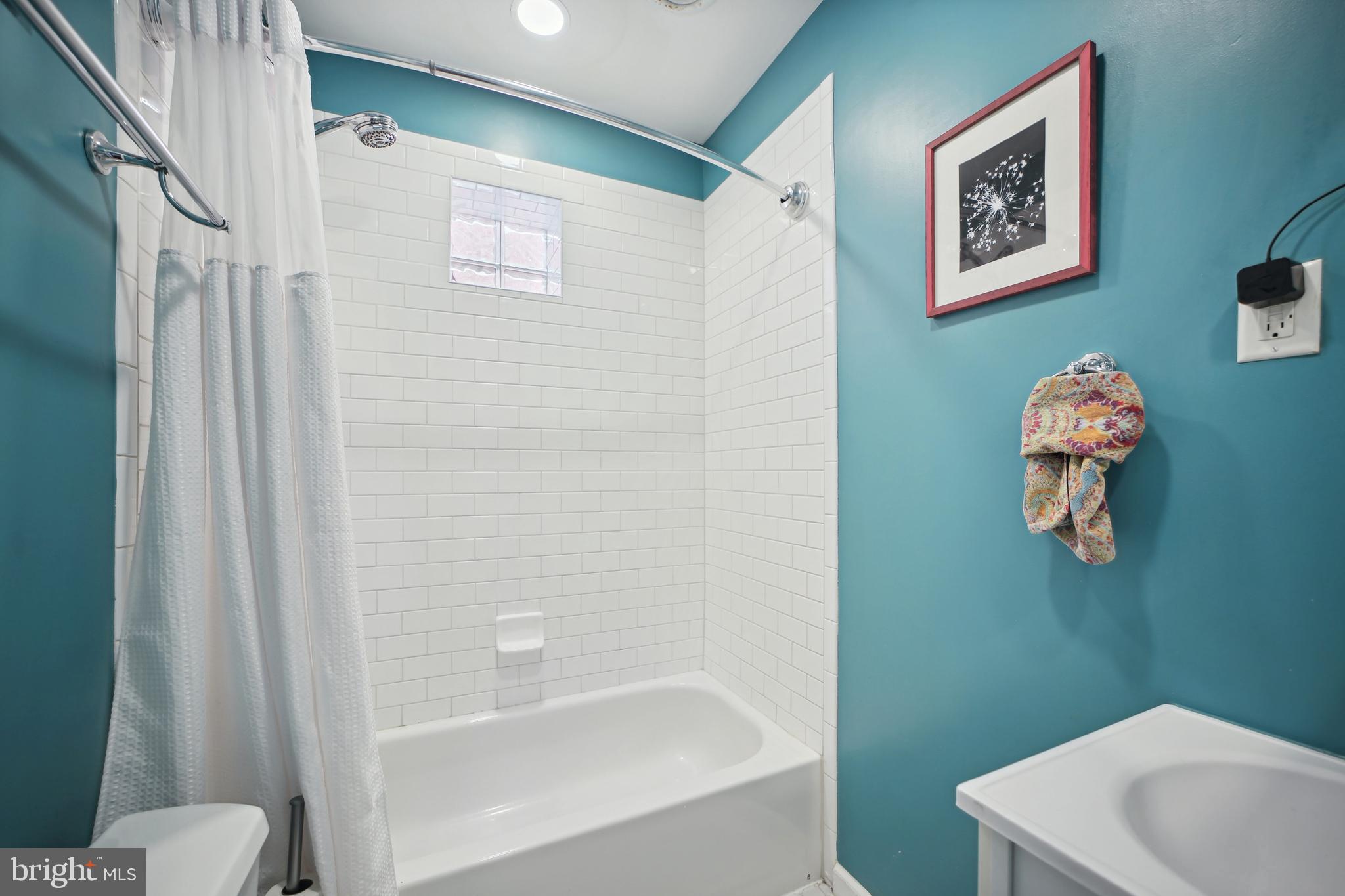 432 15th Street Southeast Washington, DC 20003 - Photo 20 of 26 a bathroom with a shower and toilet