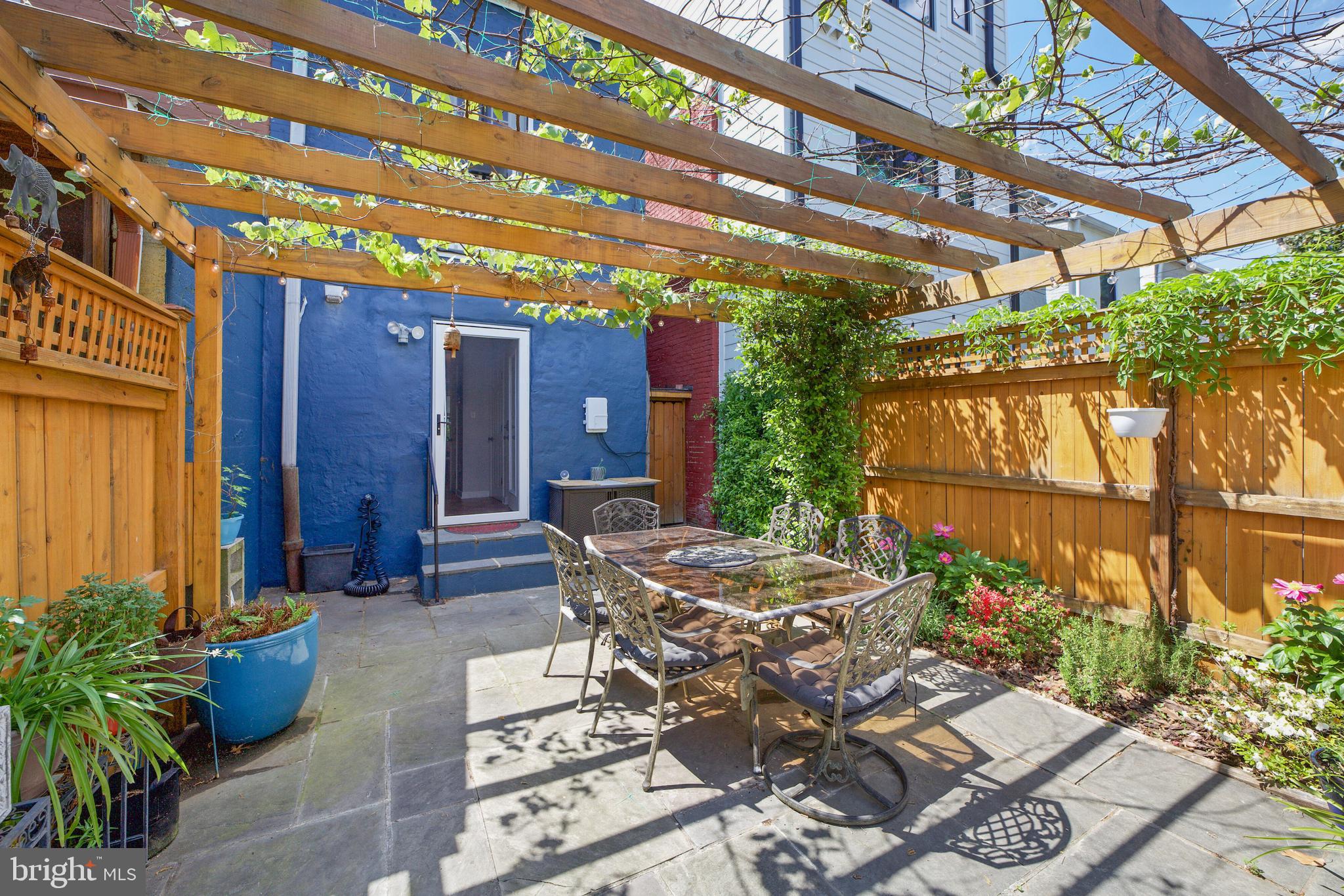 432 15th Street Southeast Washington, DC 20003 - Photo 24 of 26 a patio with water fountain and couches