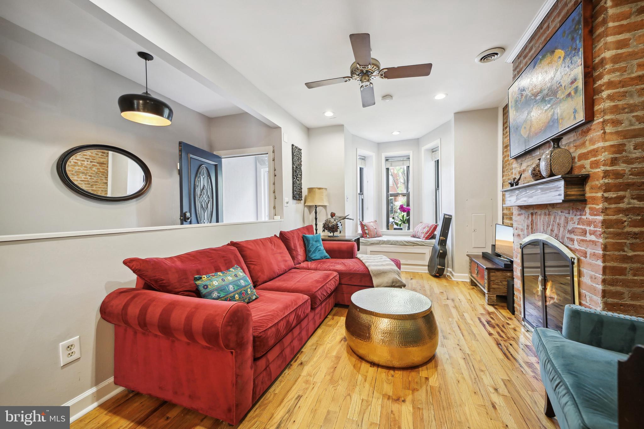 432 15th Street Southeast Washington, DC 20003 - Photo 4 of 26 a living room with furniture and a fireplace
