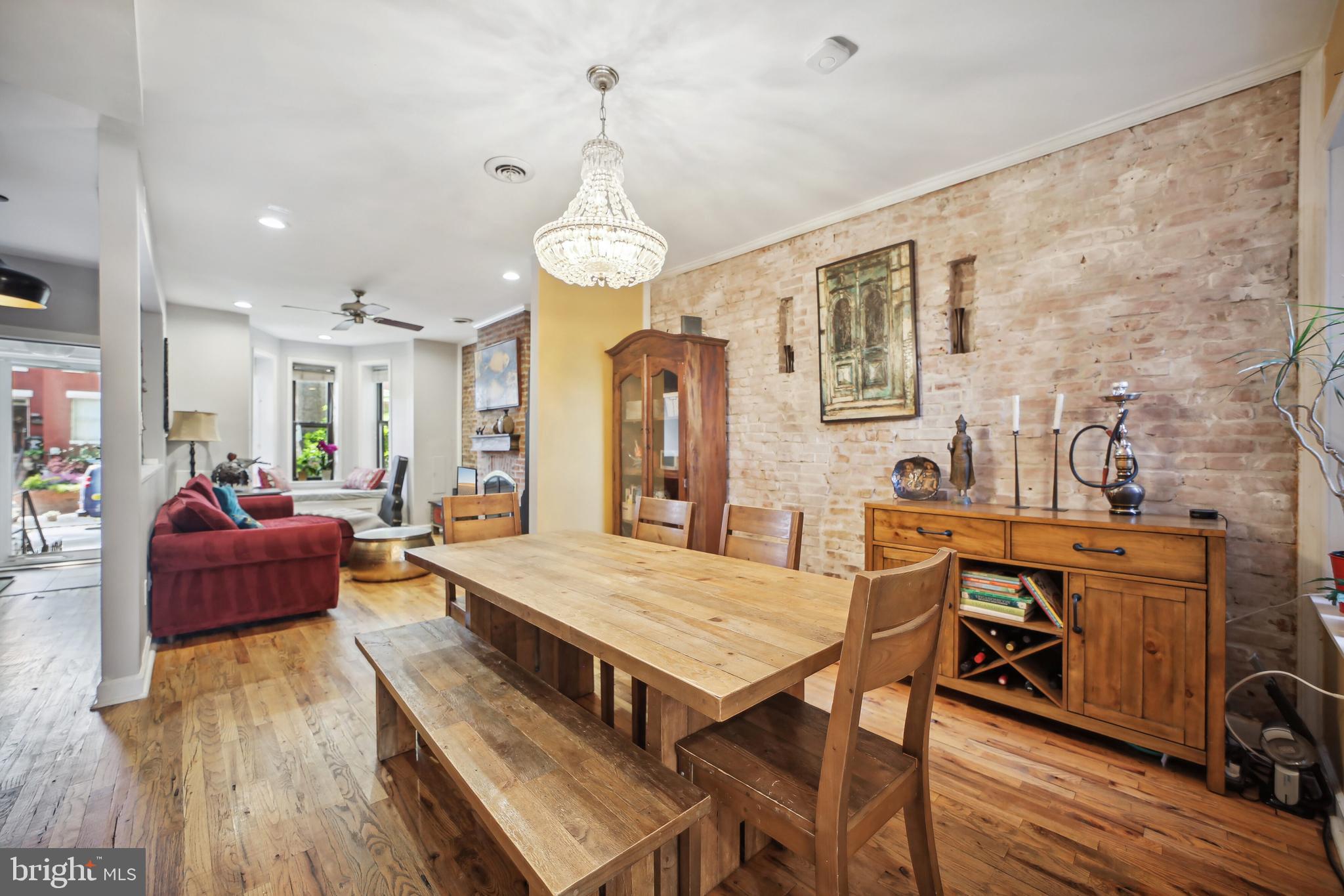432 15th Street Southeast Washington, DC 20003 - Photo 7 of 26 a view of a dining room with furniture a chandelier and wooden floor