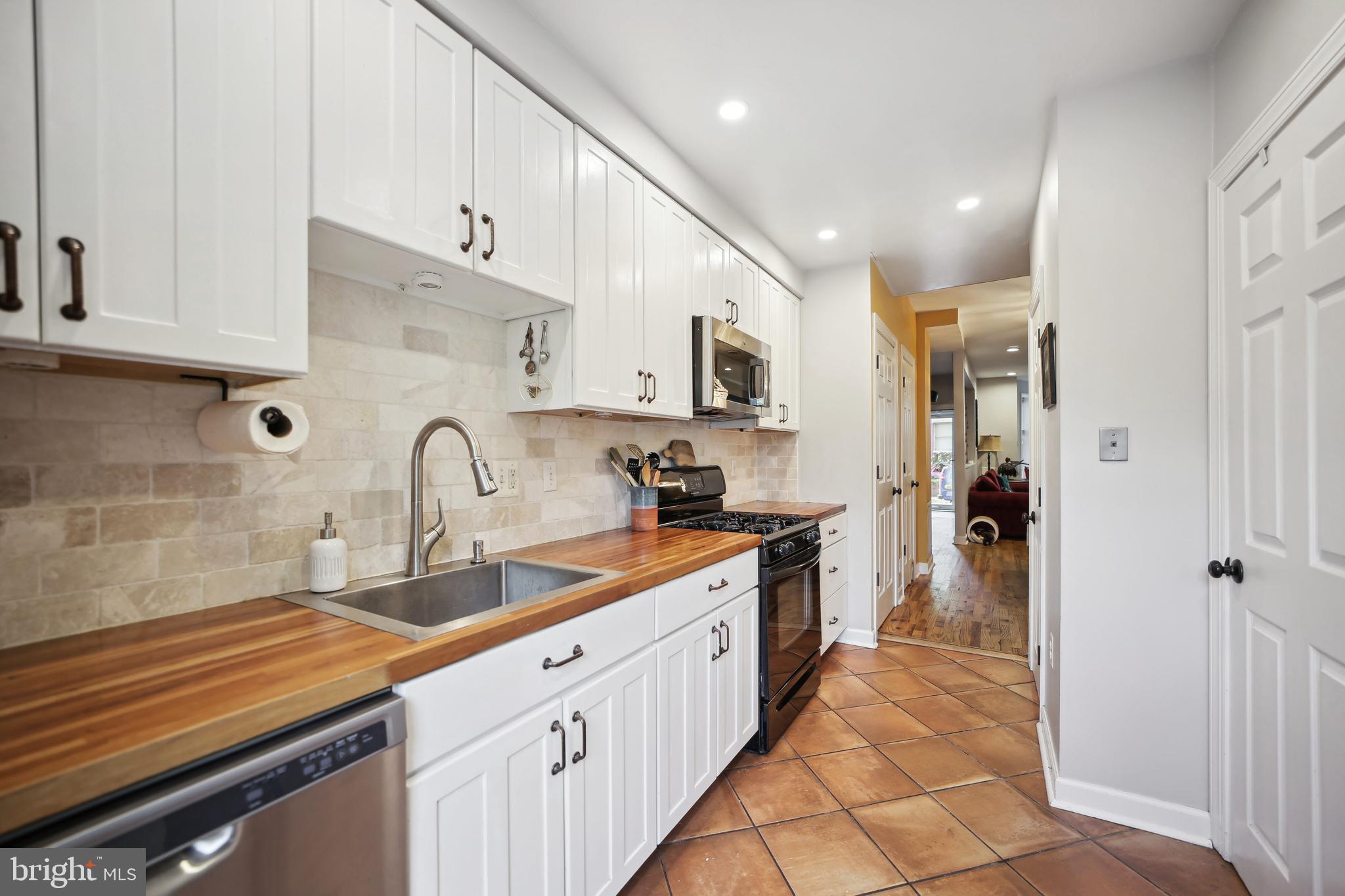 432 15th Street Southeast Washington, DC 20003 - Photo 10 of 26 a kitchen with stainless steel appliances granite countertop a sink and cabinets